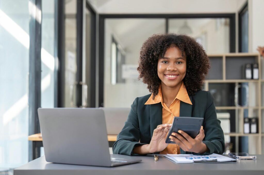 Accountant black woman working on laptop and do document, tax, exchange, accounting and Financial